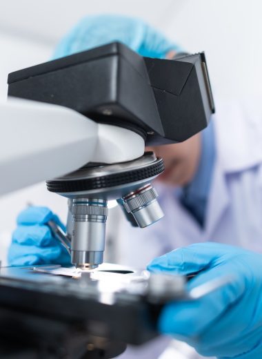 Scientist Using Microscope